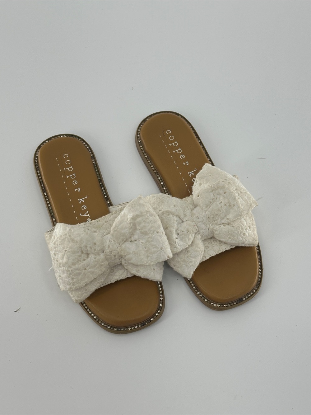 Copper Key Ivory Lace Bow Slide Sandals